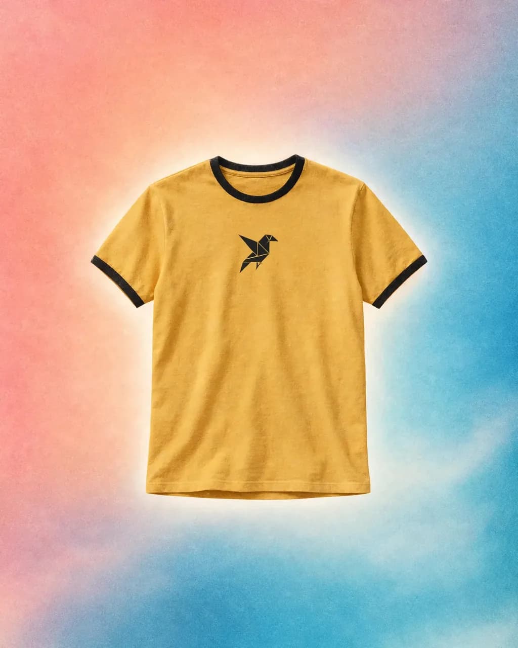 Mustard tee with a black geometric bird emblem