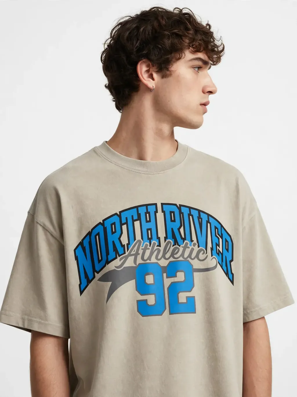 A model wearing the same design on an oversized tee