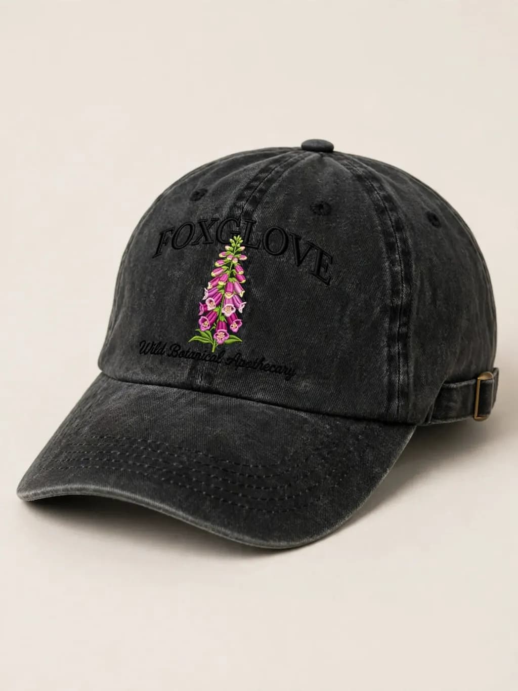 Washed black dad cap with a small front graphic