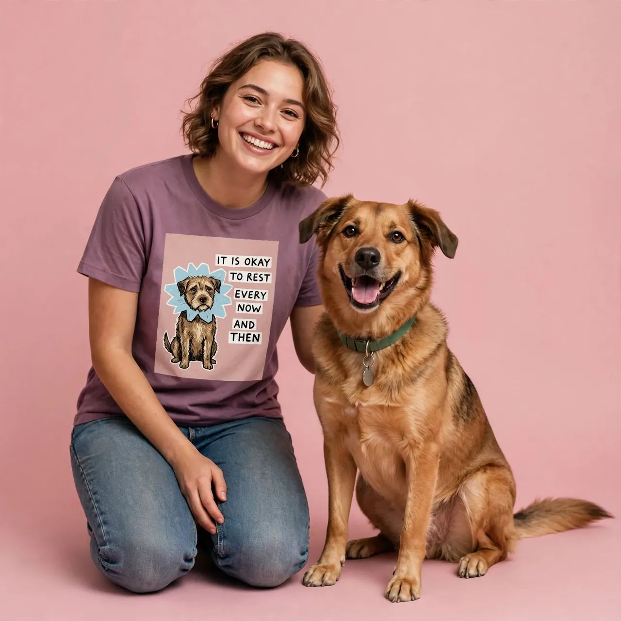 Creator in a dusty-purple rescue tee kneeling beside a happy dog on a rose backdrop