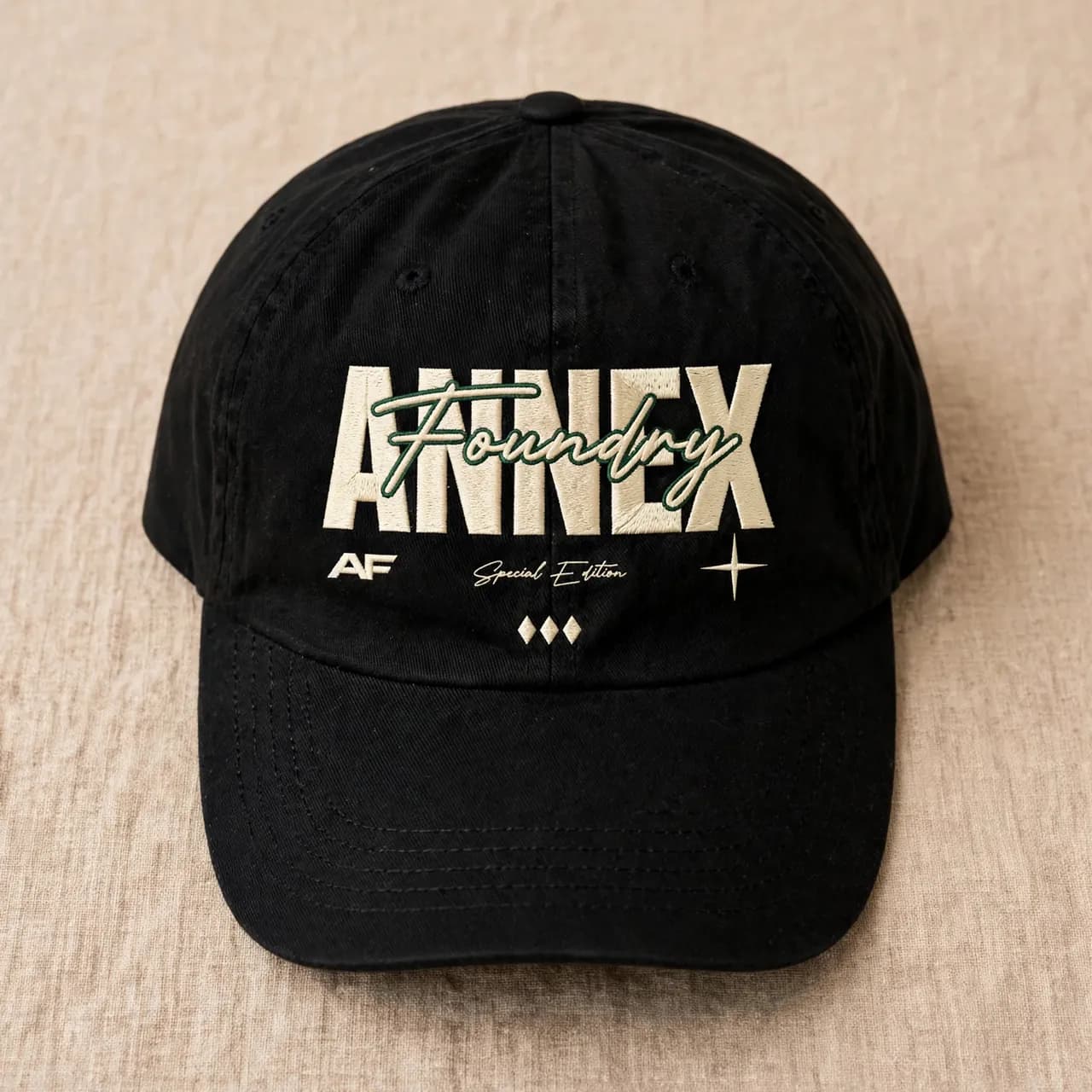 Black dad cap with a small embroidered emblem