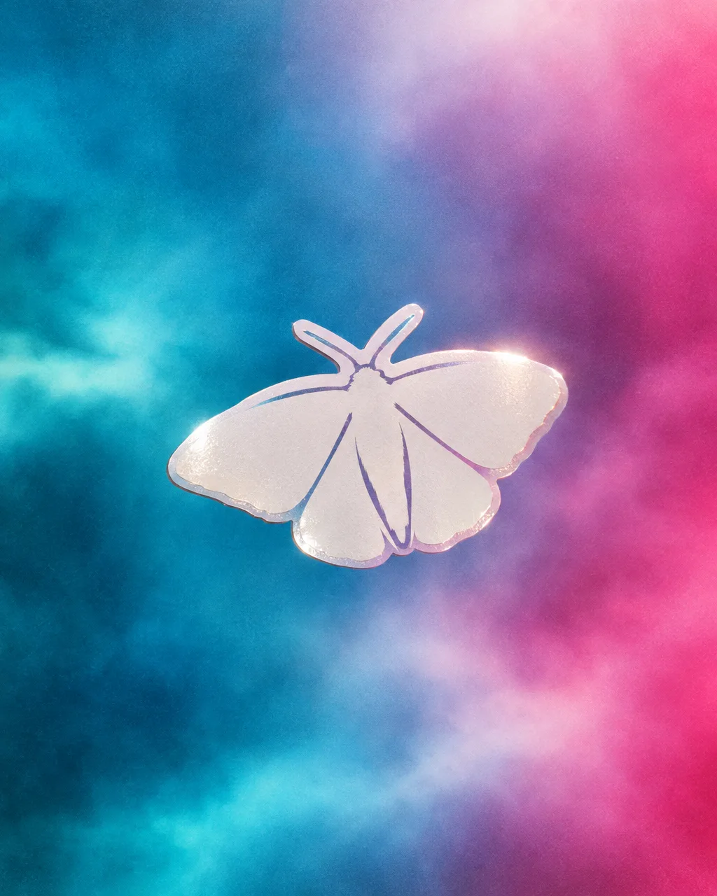 White moth vinyl sticker hovering on a cyan and magenta wash